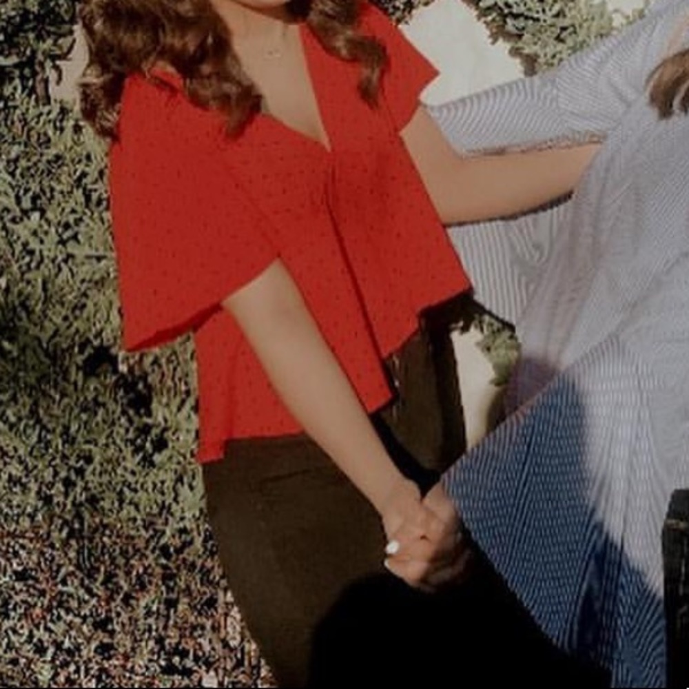 Red and black polka dot shirt